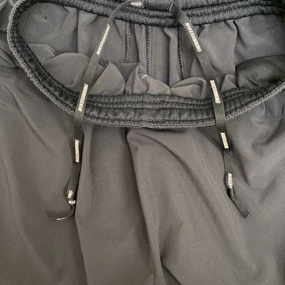Nike Men’s Dri-Fit black running joggers. Size small.